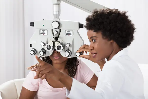 Why do moms have to visit the optometrist twice?