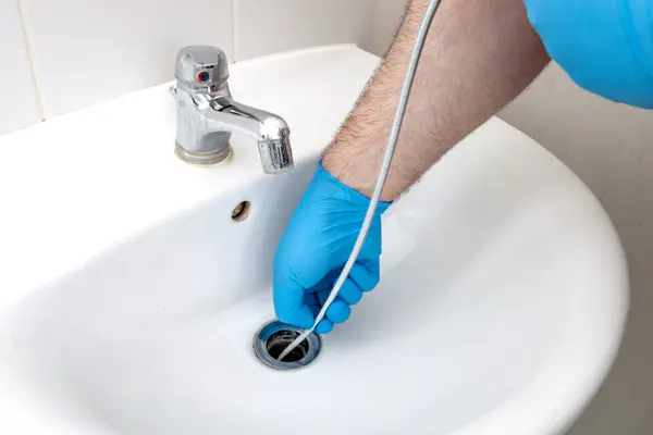 Which actor is a pro at unclogging a drain?